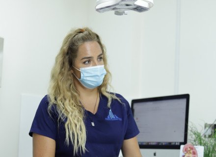 Veterinarian with cat on table